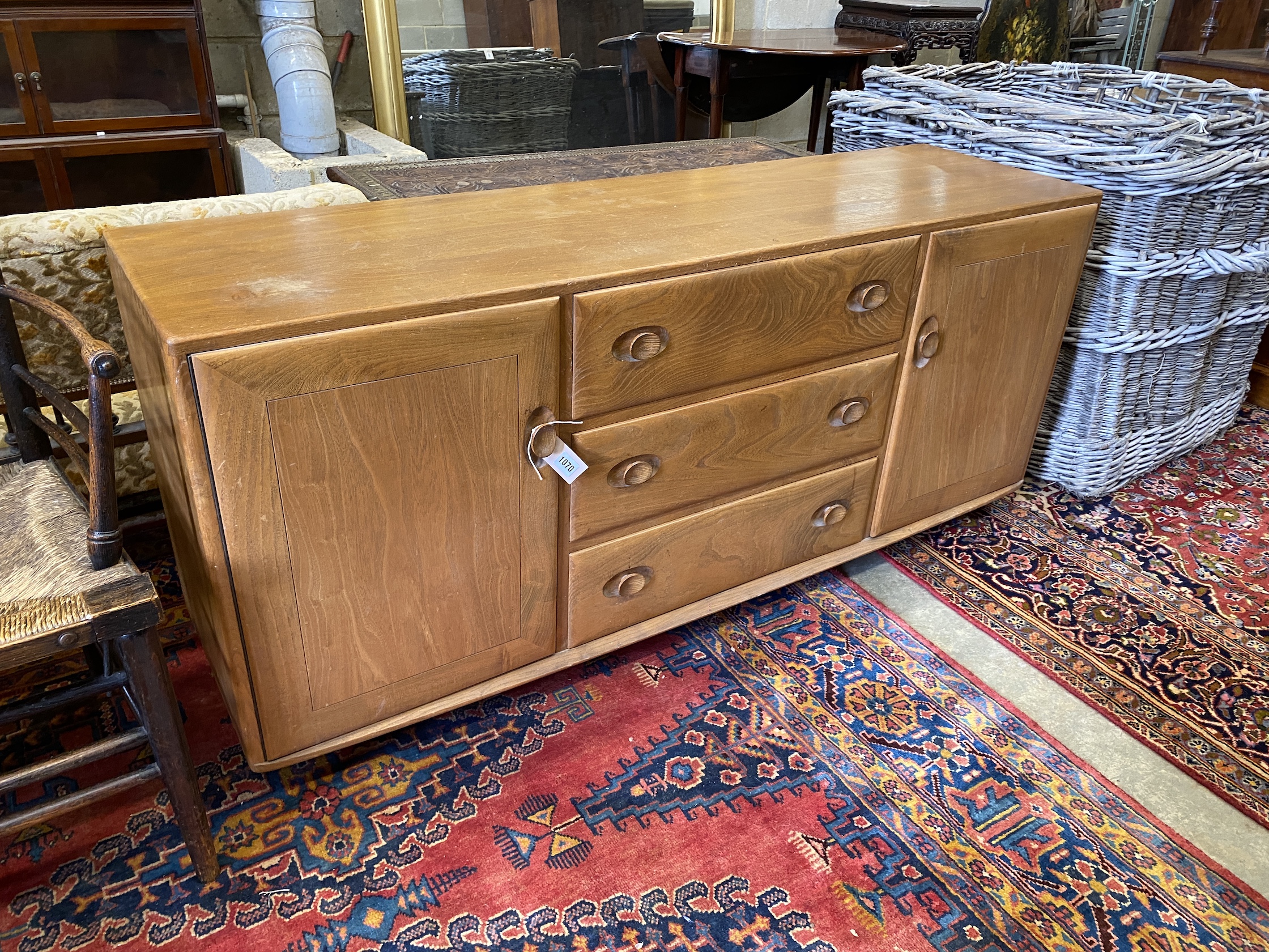 An Ercol light elm sideboard, length 155cm, depth 43cm, height 68cm